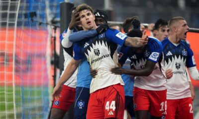 Hamburg's Luka Vuskovic, front, celebrates after scoring his side's second goal during the German Bundesliga soccer match between Hamburger SV and SV Werder Bremen in Hamburg, Germany, Sunday, Dec. 7, 2025. (Marcus Brandt/dpa via AP)