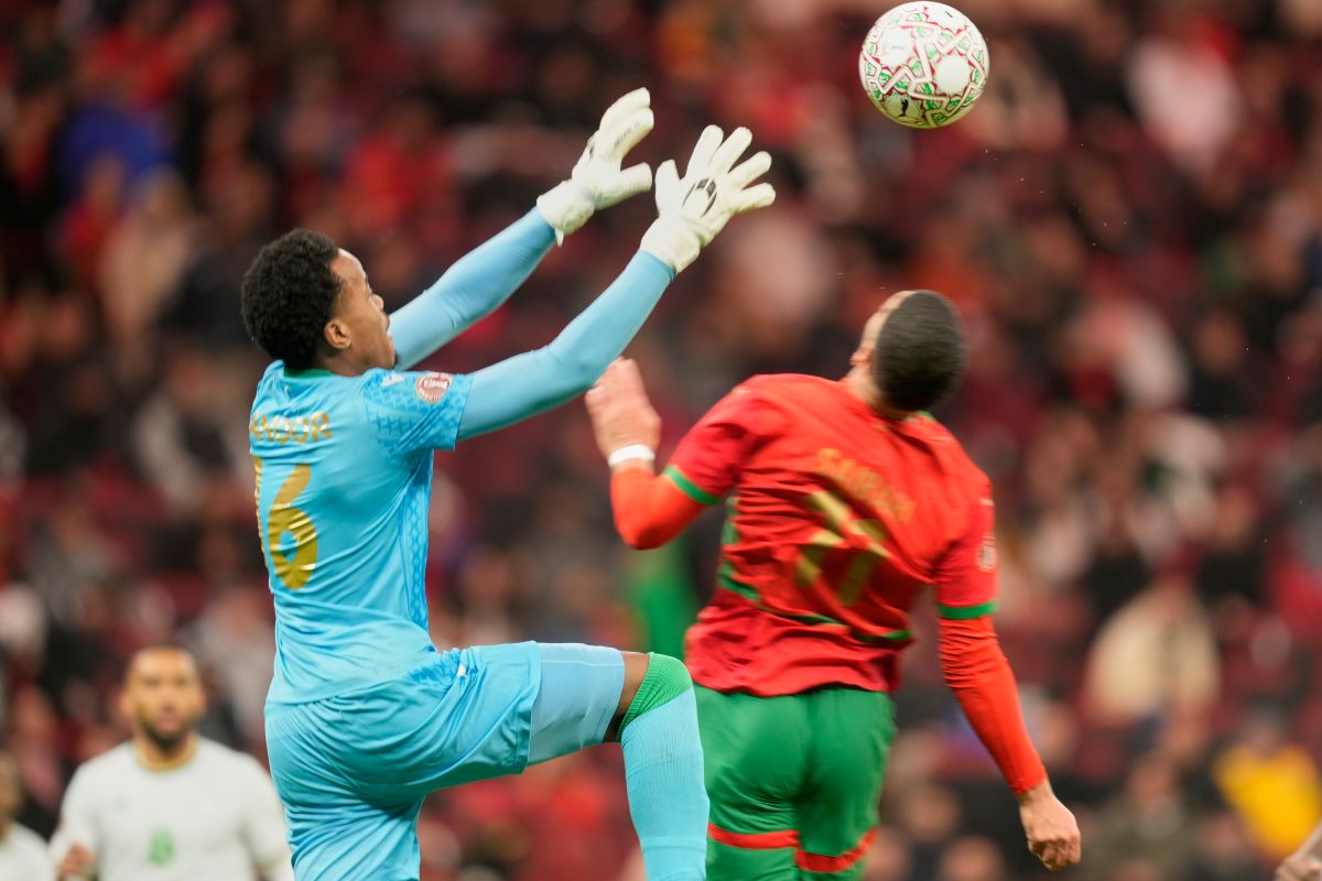 Comoros' goalkeeper Yannick Marc Ahmed Pandor catches the ball during the Africa Cup of Nations group A soccer match between Morocco and Comoros in Rabat, Morocco, Sunday, Dec. 21, 2025. (AP Photo/Mosa'ab Elshamy)