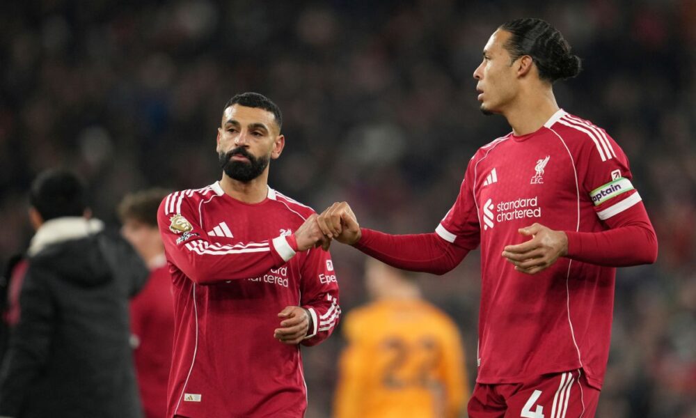 Liverpool's Mohamed Salah, left, and Virgil van Dijk greet each other after the English Premier League soccer match between Liverpool and Sunderland in Liverpool, Wednesday, Dec. 3, 2025. (AP Photo/Jon Super)