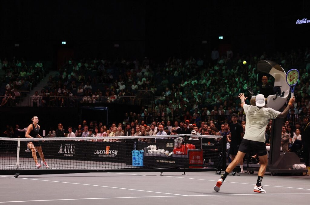 Nick Kyrgios plays a volley against Aryna Sabalenka during their Battle of the Sexes tennis match in Dubai, United Arab Emirates, Sunday Dec. 28, 2025. (Amr Alfiky/Pool Photo via AP)