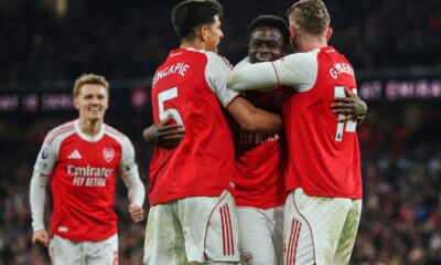 Arsenal's Bukayo Saka, second right, celebrates with teammates after his team scored the opening goal during the English Premier League soccer match between Arsenal and Wolves in London, Sunday, Dec. 14, 2025. (AP Photo/Richard Pelham)