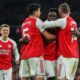 Arsenal's Bukayo Saka, second right, celebrates with teammates after his team scored the opening goal during the English Premier League soccer match between Arsenal and Wolves in London, Sunday, Dec. 14, 2025. (AP Photo/Richard Pelham)