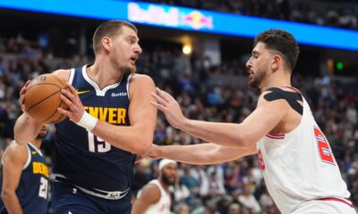 Denver Nuggets center Nikola Jokic pulls in a rebound as Houston Rockets center Alperen Sengun defends in the second half of an NBA basketball game Monday, Dec. 15, 2025, in Denver. (AP Photo/David Zalubowski)