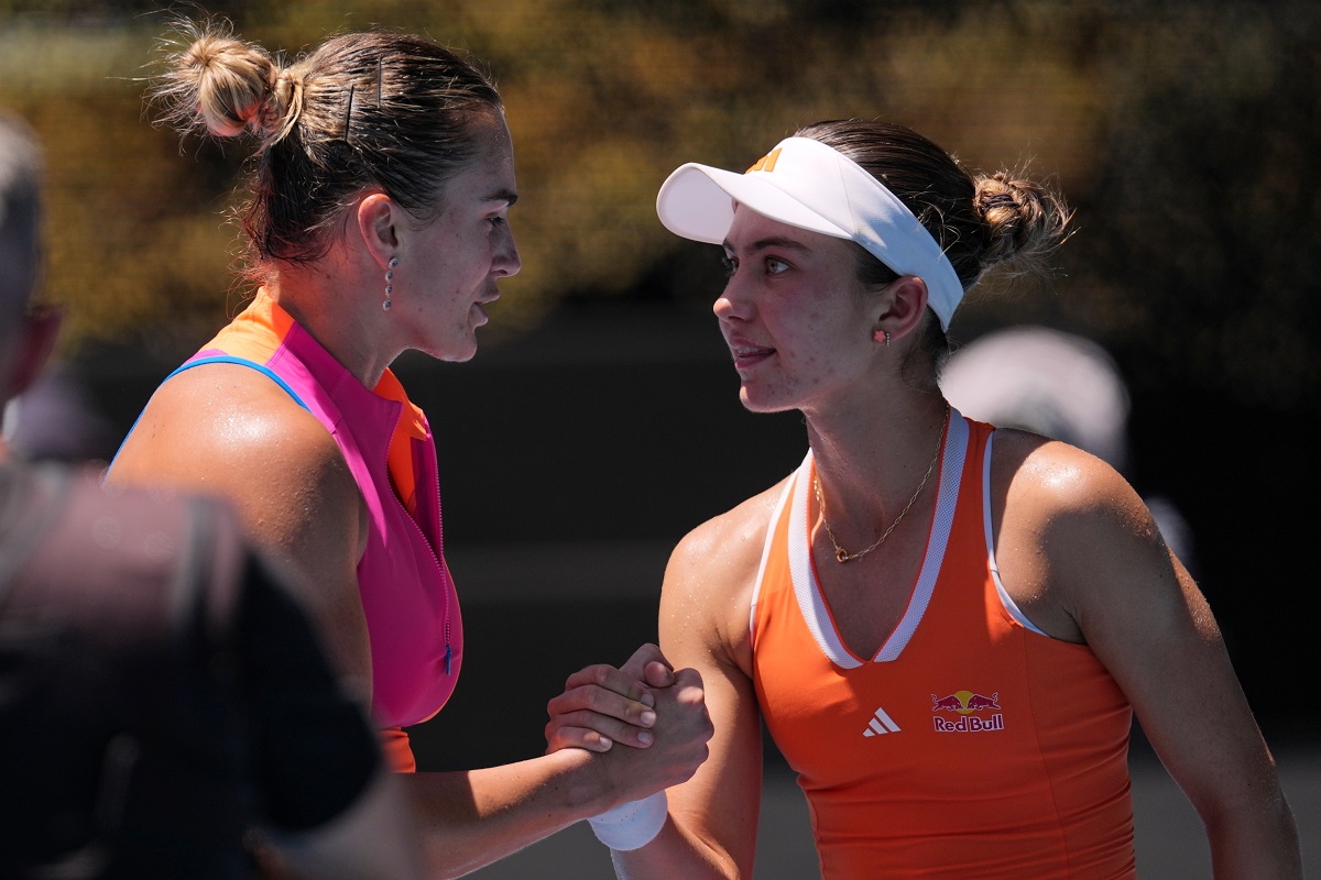 Aryna Sabalenka, left, of Belarus is congratulated by Iva Jovic of the U.S. following their quarterfinal match at the Australian Open tennis championship in Melbourne, Australia, Tuesday, Jan. 27, 2026. (AP Photo/Dar Yasin)