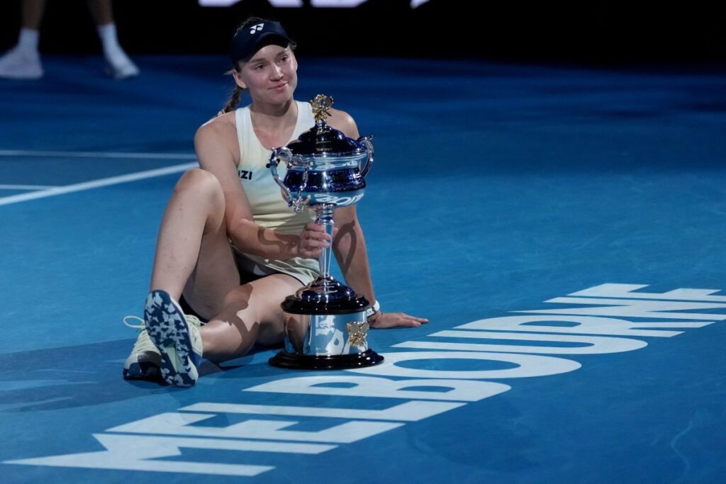 Elena Rybakina of Kazakhstan poses with the Daphne Akhurst Memorial Cup after defeating Aryna Sabalenka of Belarus to win the women's singles final at the Australian Open tennis championship in Melbourne, Australia, Saturday, Jan. 31, 2026. (AP Photo/Aaron Favila)