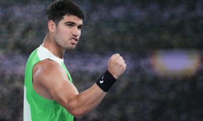 Carlos Alcaraz of Spain celebrates after defeating Adam Walton of Australia in their first round match at the Australian Open tennis championship in Melbourne, Australia, Sunday, Jan. 18, 2026. (AP Photo/Dita Alangkara)