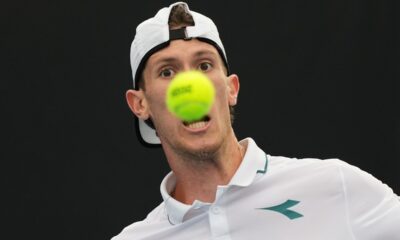 Francesco Maestrelli of Italy plays a forehand return to Terence Atmane of France during their first round match at the Australian Open tennis championship in Melbourne, Australia, Monday, Jan. 19, 2026. (AP Photo/Dar Yasin)