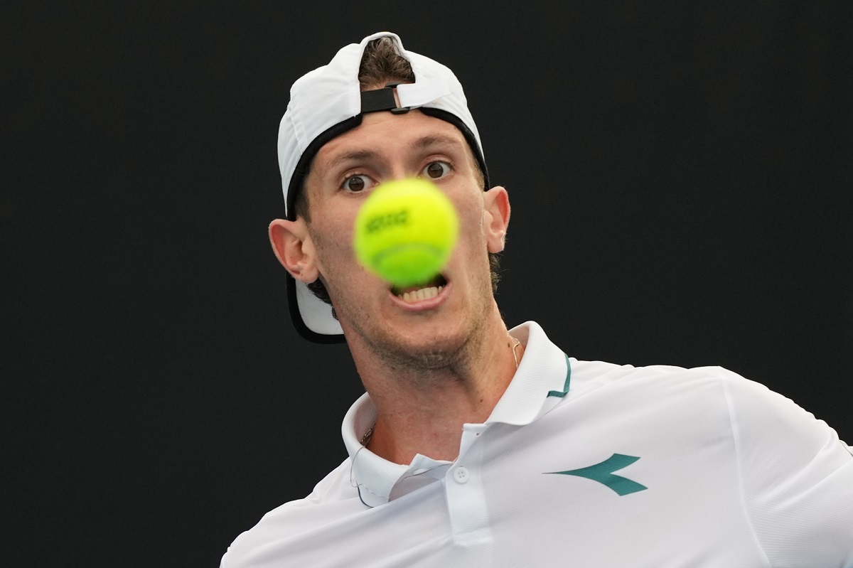 Francesco Maestrelli of Italy plays a forehand return to Terence Atmane of France during their first round match at the Australian Open tennis championship in Melbourne, Australia, Monday, Jan. 19, 2026. (AP Photo/Dar Yasin)