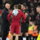 Liverpool's manager Arne Slot, left, talks with referee Andy Madley after the English Premier League soccer match between Liverpool and Burnley in Liverpool, England, Saturday, Jan. 17, 2026. (AP Photo/Jon Super)