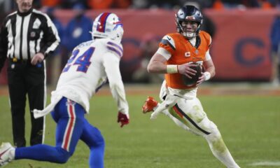 Denver Broncos quarterback Bo Nix, right, runs as Buffalo Bills safety Cole Bishop pursues in overtime of an NFL divisional football game Saturday, Jan. 17, 2026, in Denver. (AP Photo/David Zalubowski)