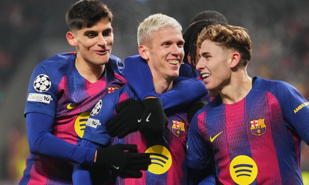 Barcelona's Dani Olmo, center, celebrates with his teammates after scoring his side's third goal during the Champions League opening phase soccer match between Slavia Prague and Barcelona in Prague, Czech Republic, Wednesday, Jan. 21, 2026. (AP Photo/Petr David Josek)