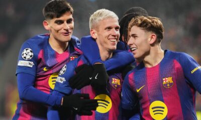 Barcelona's Dani Olmo, center, celebrates with his teammates after scoring his side's third goal during the Champions League opening phase soccer match between Slavia Prague and Barcelona in Prague, Czech Republic, Wednesday, Jan. 21, 2026. (AP Photo/Petr David Josek)