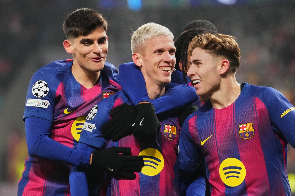 Barcelona's Dani Olmo, center, celebrates with his teammates after scoring his side's third goal during the Champions League opening phase soccer match between Slavia Prague and Barcelona in Prague, Czech Republic, Wednesday, Jan. 21, 2026. (AP Photo/Petr David Josek)