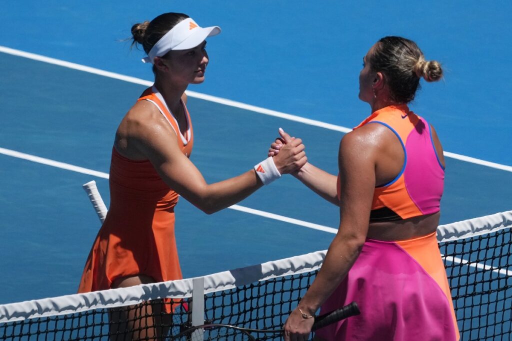 Aryna Sabalenka, right, of Belarus is congratulated by Iva Jovic, left, of the U.S. during their quarterfinal match at the Australian Open tennis championship in Melbourne, Australia, Tuesday, Jan. 27, 2026. (AP Photo/Asanka Brendon Ratnayake)