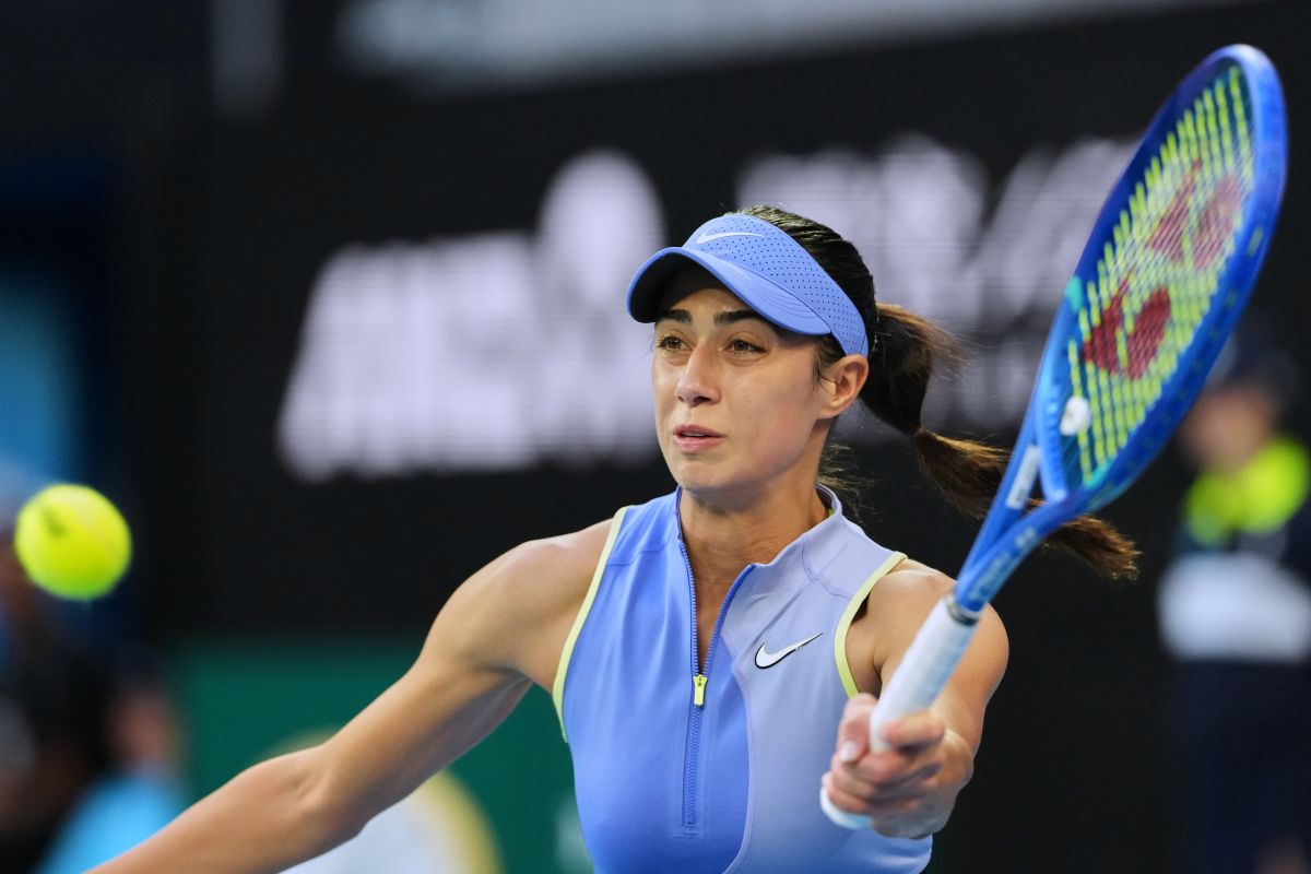Olga Danilovic of Serbia plays a forehand return to Venus Williams of the U.S. during their first round match at the Australian Open tennis championship in Melbourne, Australia, Sunday, Jan. 18, 2026. (AP Photo/Aaron Favila)
