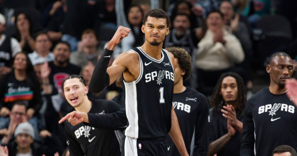 San Antonio Spurs center Victor Wembanyama (1) celebrates a basket during the second half of an NBA basketball game against the New York Knicks, Wednesday, Dec. 31, 2025, in San Antonio. (AP Photo/Darren Abate)