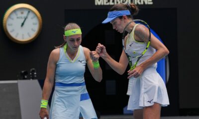 Anna Danilina of Kazakhstan and Aleksandra Krunic of Serbia react against Elise Mertens of Belgium and Zhang Shuai of China during the women's doubles final at the Australian Open tennis championship in Melbourne, Australia, Saturday, Jan. 31, 2026. (AP Photo/Aaron Favila)