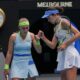 Anna Danilina of Kazakhstan and Aleksandra Krunic of Serbia react against Elise Mertens of Belgium and Zhang Shuai of China during the women's doubles final at the Australian Open tennis championship in Melbourne, Australia, Saturday, Jan. 31, 2026. (AP Photo/Aaron Favila)