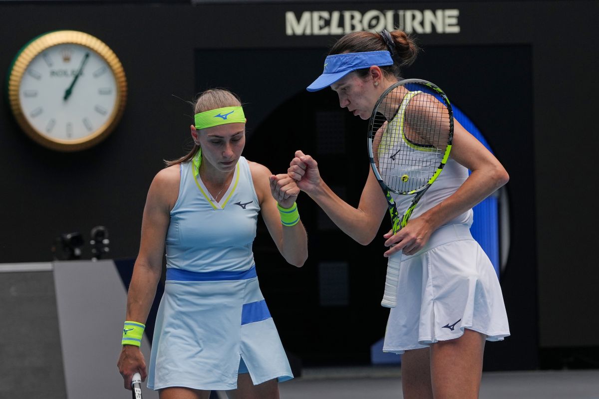 Anna Danilina of Kazakhstan and Aleksandra Krunic of Serbia react against Elise Mertens of Belgium and Zhang Shuai of China during the women's doubles final at the Australian Open tennis championship in Melbourne, Australia, Saturday, Jan. 31, 2026. (AP Photo/Aaron Favila)