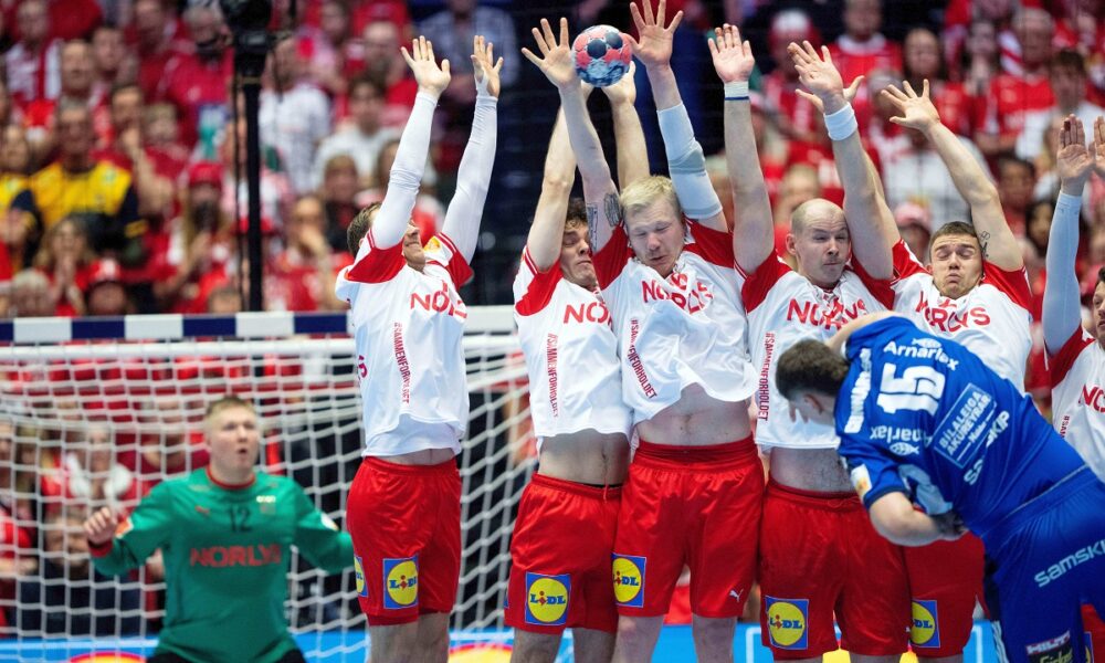 Denmark's players attempt to block against Iceland's Thorsteinn Leo Gunnarsson during the Euro 2026 semifinal match between Denmark and Iceland at in Herning, Denmark, Friday, Jan. 30, 2026. (Bo Amstrup/Ritzau Scanpix via AP)