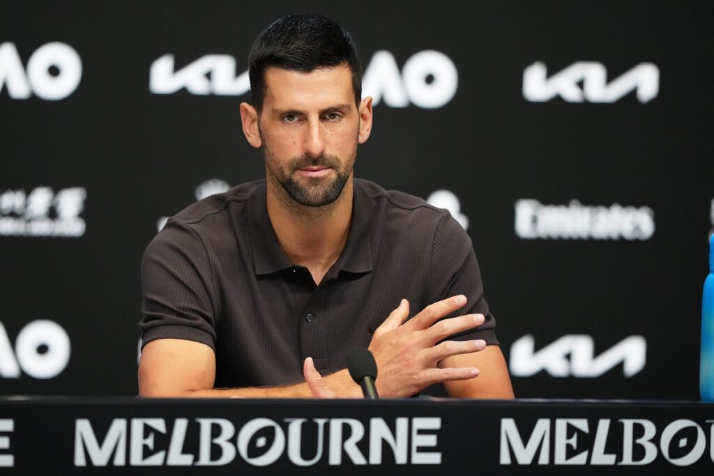 Novak Djokovic of Serbia reacts during a press conference ahead of the Australian Open tennis championship in Melbourne, Australia, Saturday, Jan. 17, 2026. (AP Photo/Aaron Favila)