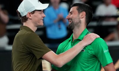 Novak Djokovic, right, of Serbia is congratulated by Jannik Sinner, left, of Italy following their semifinal match at the Australian Open tennis championship in Melbourne, Australia, early Saturday, Jan. 31, 2026. (AP Photo/Aaron Favila)