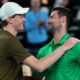 Novak Djokovic, right, of Serbia is congratulated by Jannik Sinner, left, of Italy following their semifinal match at the Australian Open tennis championship in Melbourne, Australia, early Saturday, Jan. 31, 2026. (AP Photo/Aaron Favila)