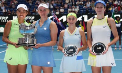 Elise Mertens of Belgium and Zhang Shuai, left, of China pose with their trophy after defeating Anna Danilina, right, of Kazakhstan and Aleksandra Krunic of Serbia in the women's doubles final at the Australian Open tennis championship in Melbourne, Australia, Saturday, Jan. 31, 2026. (AP Photo/Aaron Favila)