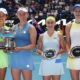 Elise Mertens of Belgium and Zhang Shuai, left, of China pose with their trophy after defeating Anna Danilina, right, of Kazakhstan and Aleksandra Krunic of Serbia in the women's doubles final at the Australian Open tennis championship in Melbourne, Australia, Saturday, Jan. 31, 2026. (AP Photo/Aaron Favila)