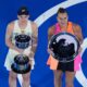 Elena Rybakina of Kazakhstan holds The Daphne Akhurst Memorial Cup, left after defeating Aryna Sabalenka of Belarus at right during the trophy ceremony for the women's singles final at the Australian Open tennis championship in Melbourne, Australia, Saturday, Jan. 31, 2026. (AP Photo/Dar Yasin)