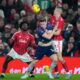 Arsenal's Viktor Gyokeres fights for the ball with Nottingham Forest's Nikola Milenkovic and Ola Aina, left, during the English Premier League soccer match between Nottingham Forest and Arsenal in Nottingham, England, Saturday, Jan. 17, 2026. (AP Photo/Dave Shopland)