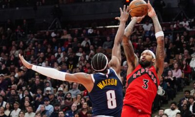 Toronto Raptors forward Brandon Ingram (3) shoots over Denver Nuggets guard Peyton Watson (8) during second half NBA action in Toronto on Wednesday Dec. 31, 2025. (Frank Gunn/The Canadian Press via AP)