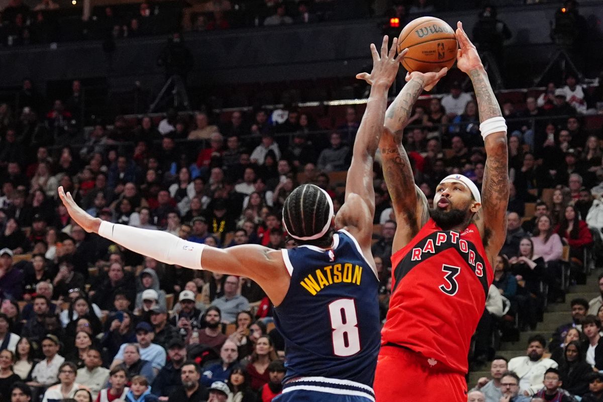 Toronto Raptors forward Brandon Ingram (3) shoots over Denver Nuggets guard Peyton Watson (8) during second half NBA action in Toronto on Wednesday Dec. 31, 2025. (Frank Gunn/The Canadian Press via AP)