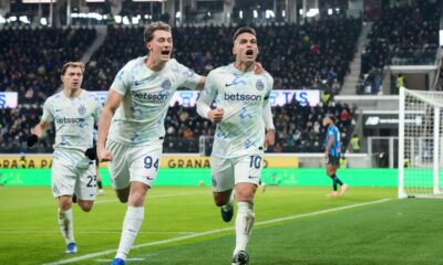 Inter Milan's Lautaro Martinez, right, celebrates after scoring a goal during the Serie A soccer match between Atalanta and Inter, in Bergamo, Italy, Sunday, Dec. 28, 2025. (Spada/LaPresse via AP)