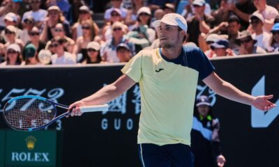 Miomir Kecmanovic of Serbia reacts during his first round match against Tomas Martin Etcheverry of Argentina at the Australian Open tennis championship in Melbourne, Australia, Sunday, Jan. 18, 2026. (AP Photo/Asanka Brendon Ratnayake)
