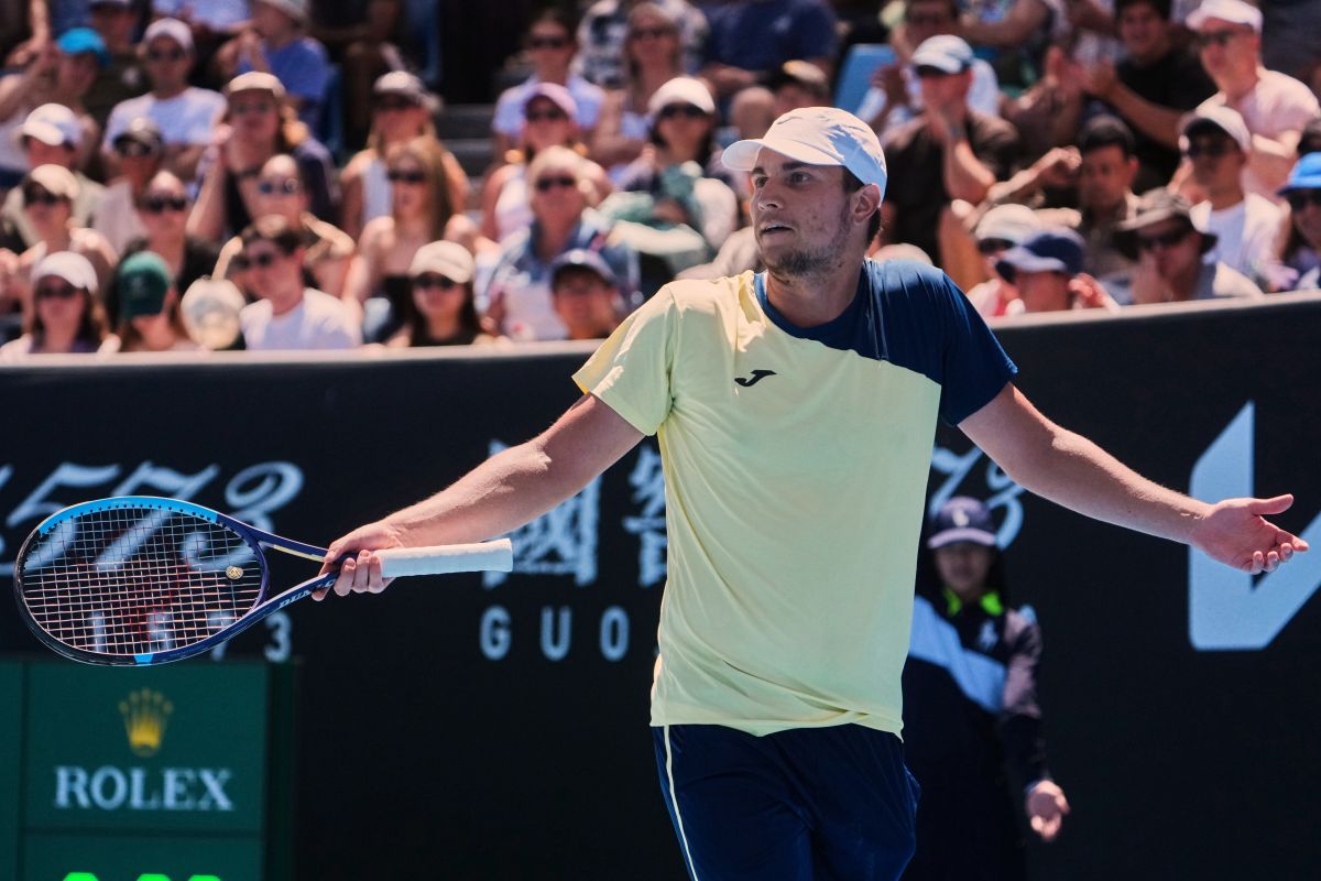 Miomir Kecmanovic of Serbia reacts during his first round match against Tomas Martin Etcheverry of Argentina at the Australian Open tennis championship in Melbourne, Australia, Sunday, Jan. 18, 2026. (AP Photo/Asanka Brendon Ratnayake)