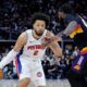 Detroit Pistons guard Cade Cunningham (2) drives against Phoenix Suns forward Royce O'Neale during the second half of an NBA basketball game, Thursday, Jan. 15, 2026, in Detroit. (AP Photo/Duane Burleson)
