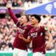 West Ham United's Mateus Fernandes, right,celebrates scoring his side's third goal with teammate Jarrod Bowen, during the English Premier League soccer match between West Ham United and Sunderland in London, Saturday Jan. 24, 2026. ( Jordan Pettitt/PA via AP)