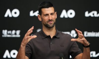 Novak Djokovic of Serbia gestures during a press conference ahead of the Australian Open tennis championship in Melbourne, Australia, Saturday, Jan. 17, 2026. (AP Photo/Aaron Favila)