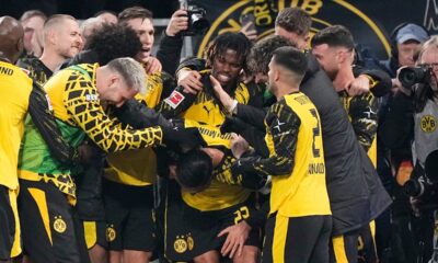 Dortmund's Emre Can is celebrated by his team after he scored his side's decisive third goal from the penalty spot during the German Bundesliga soccer match between Borussia Dortmund and St. Pauli in Dortmund, Germany, Saturday, Jan. 17, 2026. (AP Photo/Martin Meissner)