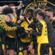 Dortmund's Emre Can is celebrated by his team after he scored his side's decisive third goal from the penalty spot during the German Bundesliga soccer match between Borussia Dortmund and St. Pauli in Dortmund, Germany, Saturday, Jan. 17, 2026. (AP Photo/Martin Meissner)