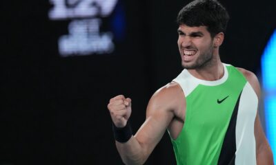Carlos Alcaraz of Spain reacts during his quarterfinal match against Alex de Minaur of Australia during their quarterfinal match at the Australian Open tennis championship in Melbourne, Australia, Tuesday, Jan. 27, 2026. (AP Photo/Dita Alangkara)