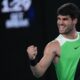 Carlos Alcaraz of Spain reacts during his quarterfinal match against Alex de Minaur of Australia during their quarterfinal match at the Australian Open tennis championship in Melbourne, Australia, Tuesday, Jan. 27, 2026. (AP Photo/Dita Alangkara)