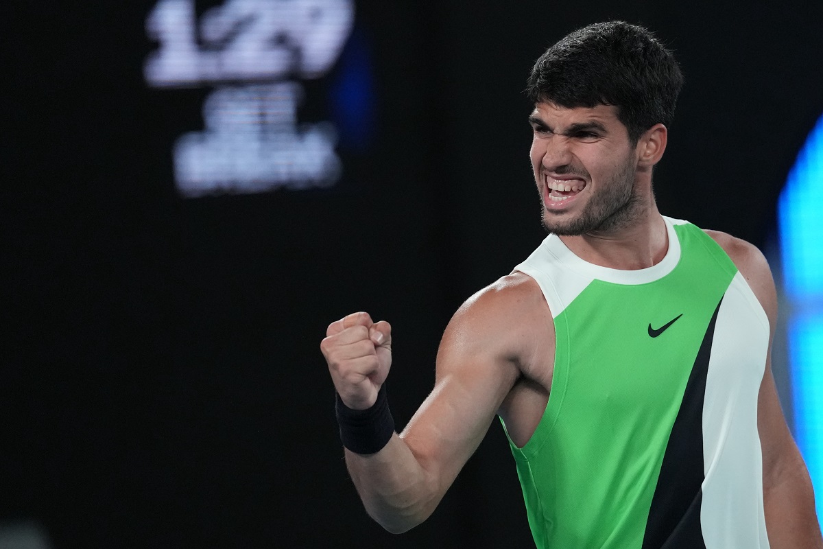 Carlos Alcaraz of Spain reacts during his quarterfinal match against Alex de Minaur of Australia during their quarterfinal match at the Australian Open tennis championship in Melbourne, Australia, Tuesday, Jan. 27, 2026. (AP Photo/Dita Alangkara)