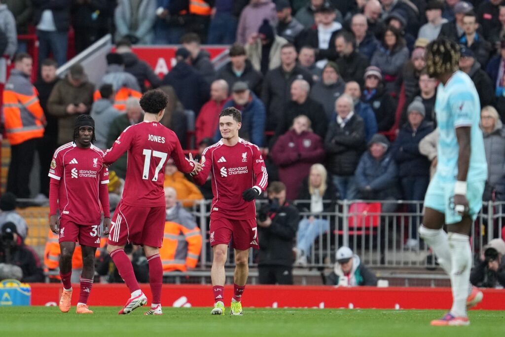 Liverpool's Florian Wirtz (7) is congratulated after scoring his side's opening goal during the English Premier League soccer match between Liverpool and Burnley in Liverpool, England, Saturday, Jan. 17, 2026. (AP Photo/Jon Super)