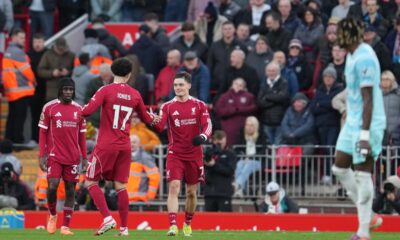 Liverpool's Florian Wirtz (7) is congratulated after scoring his side's opening goal during the English Premier League soccer match between Liverpool and Burnley in Liverpool, England, Saturday, Jan. 17, 2026. (AP Photo/Jon Super)