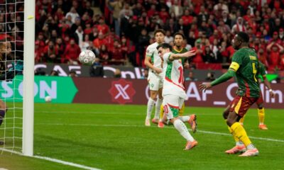 Morocco's Brahim Abdelkader Díaz, right, scores his side's opening goal during the Africa Cup of Nations quarterfinal soccer match between Cameroon and Morocco, in Rabat, Morocco, Friday, Jan. 9, 2026. (AP Photo/Mosa'ab Elshamy)