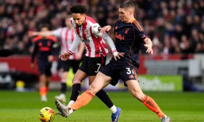 Brentford's Kevin Schade, left, and Nottingham Forest's Nikola Milenkovic battle for the ball during their English Premier League soccer match in London, Sunday, Jan. 25, 2026. (Nick Potts/PA via AP)