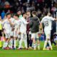 Real Madrid players celebrate at the end of the Spanish La Liga soccer match against Levante in Madrid, Spain, Saturday, Jan. 17, 2026. (AP Photo/Jose Breton)