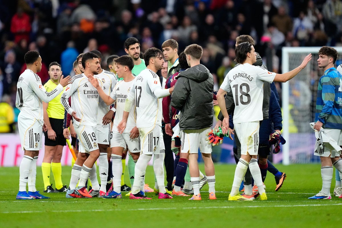 Real Madrid players celebrate at the end of the Spanish La Liga soccer match against Levante in Madrid, Spain, Saturday, Jan. 17, 2026. (AP Photo/Jose Breton)